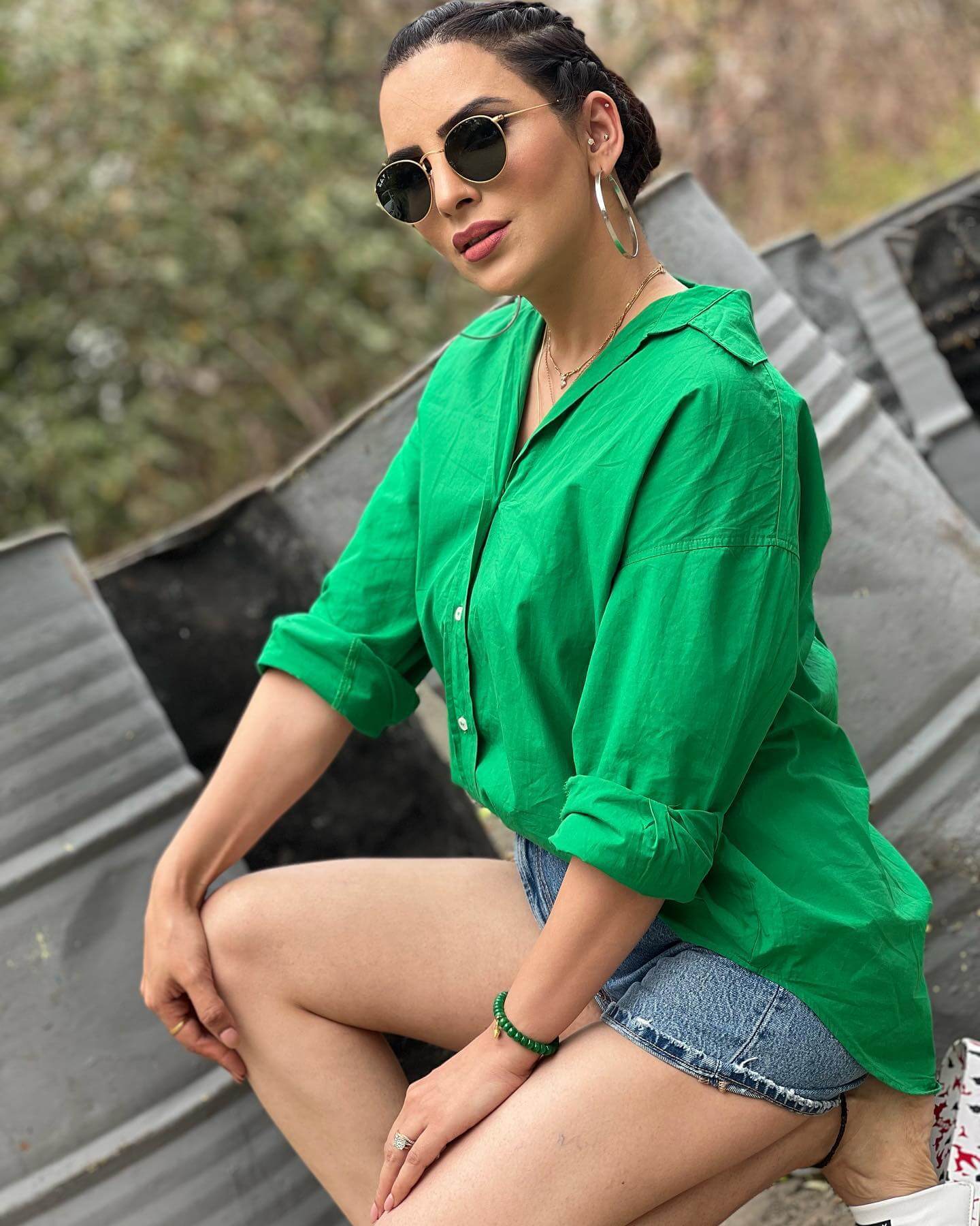 Actress Mansi Sharma in green shirt and jeans shorts