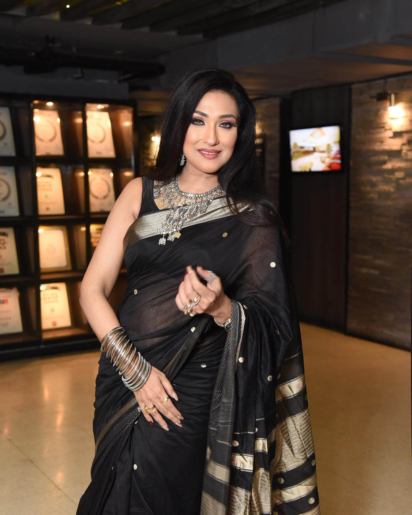 Actress Rituparna Sengupta in black saree and sleeveless blouse