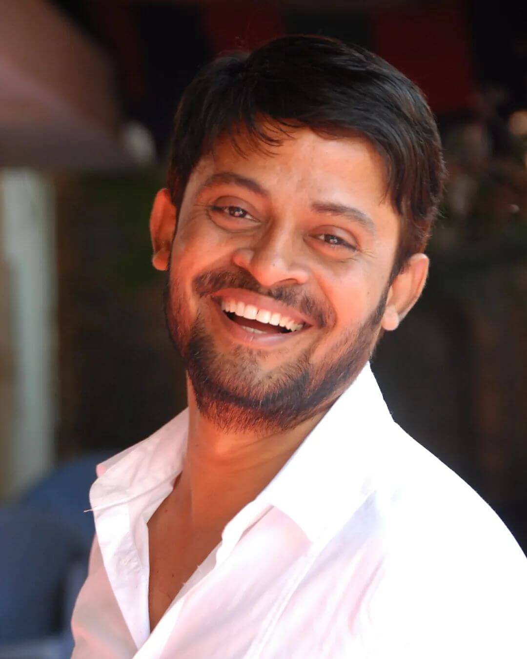 Actor Shafi close up shot in white shirt