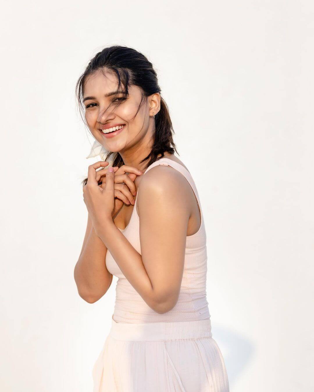 Actress Vani Bhojan  in white tank top