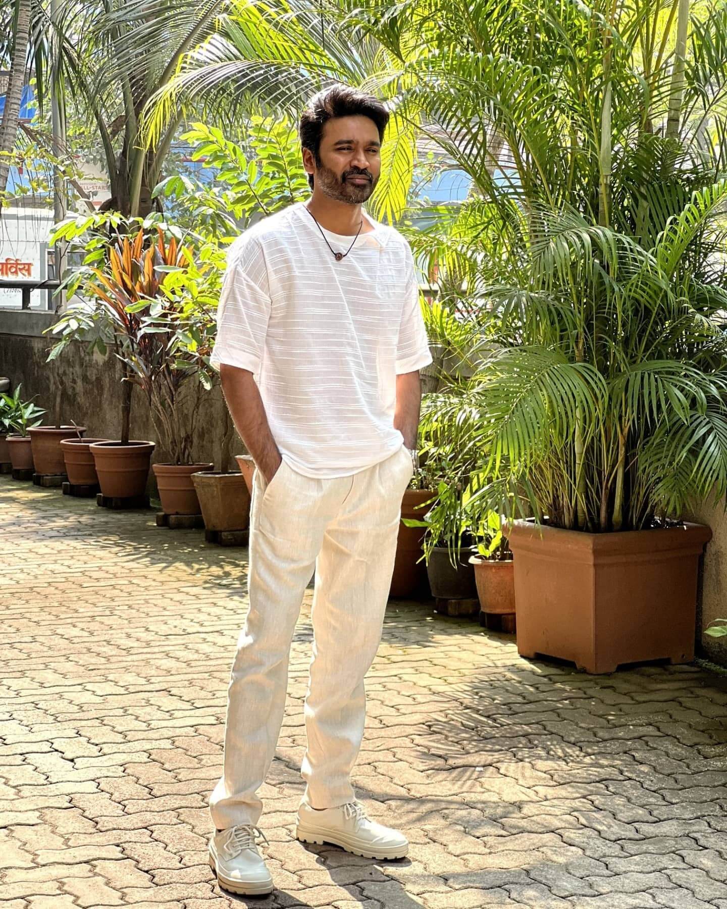 Actor Dhanush in white outfit
