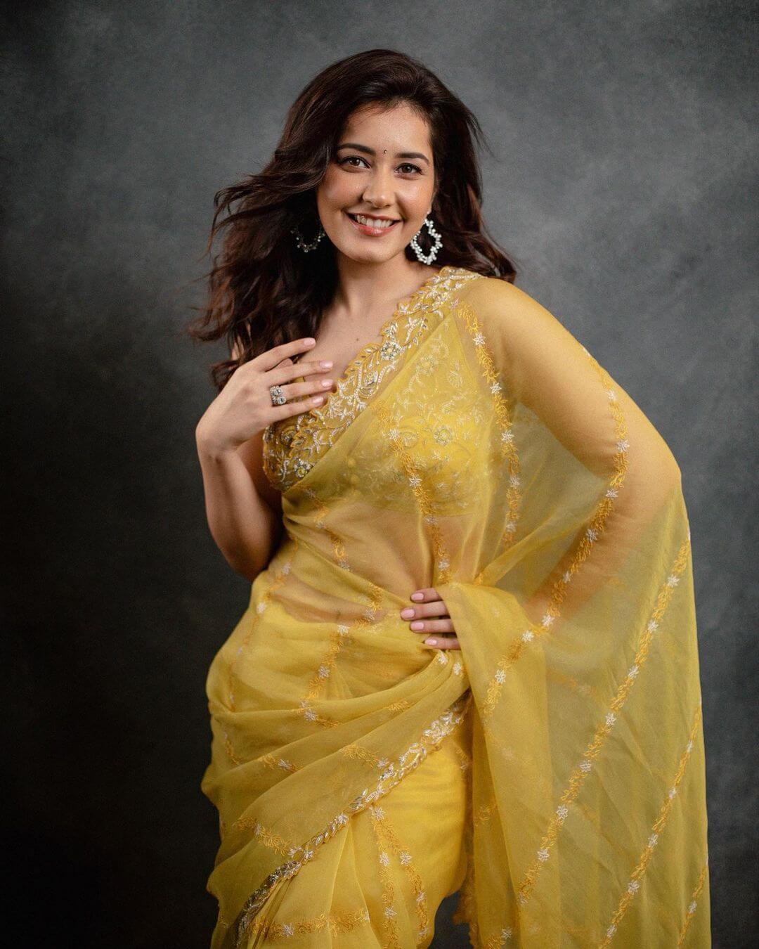 Actress Raashi Khanna in yellow saree and sleeveless blouse
