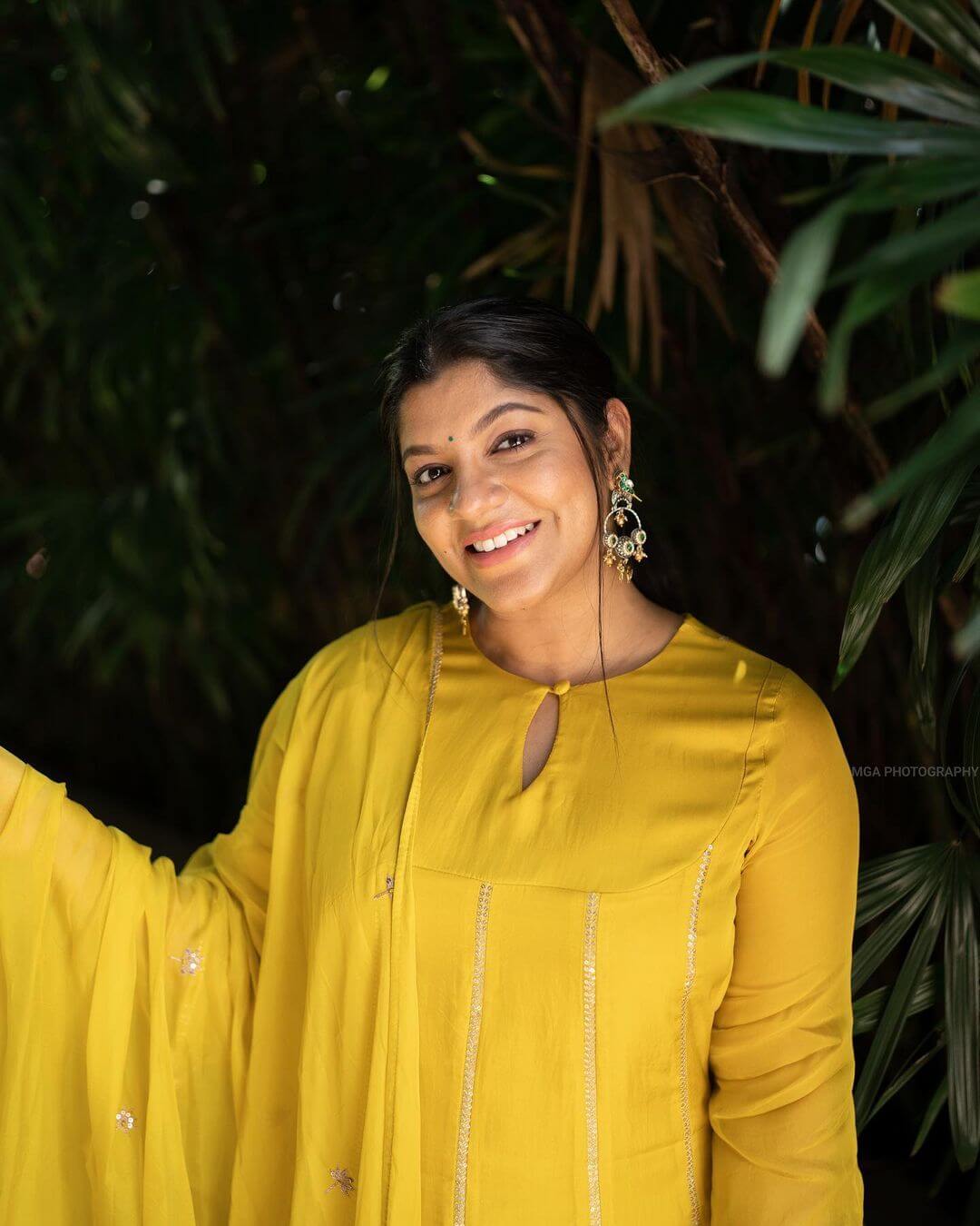Actress Aparna Balamurali close up in yellow salwar