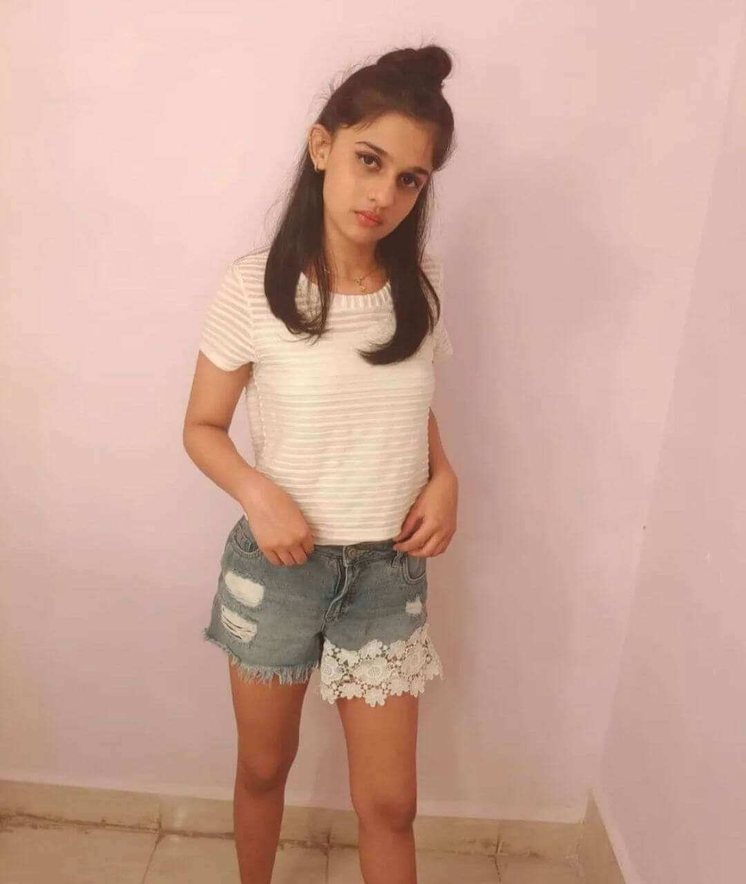 Actress Shruti Choudhary in white top and jeans shorts