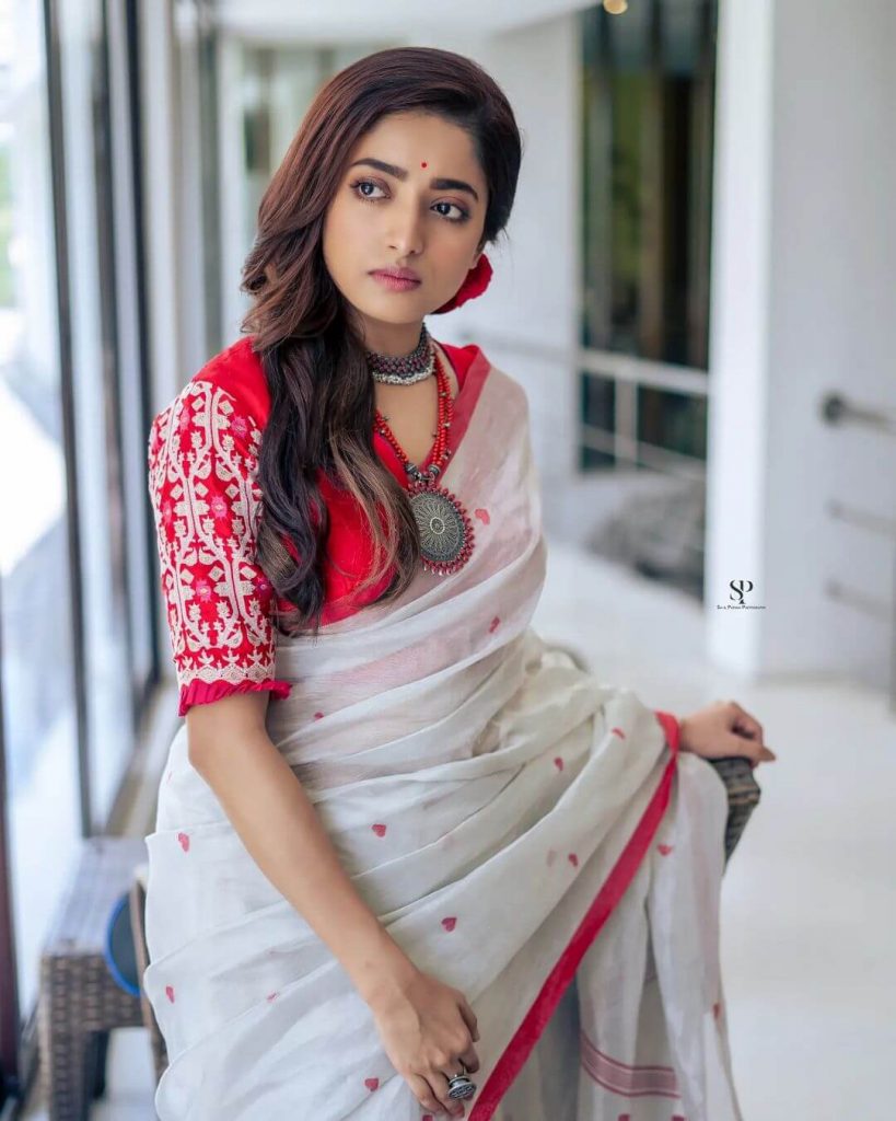 Actress Ishaa Saha in white saree and red blouse