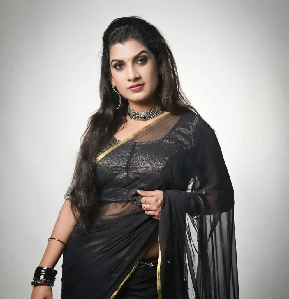 Actress Ishani Niya in black transparent saree
