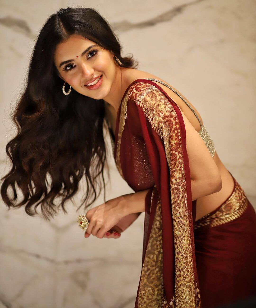Actress Malvika Sharma sexy look in maroon saree