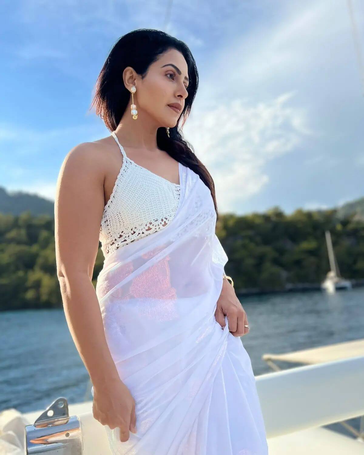 Actress Nandini Rai in sexy white saree and sleeveless blouse