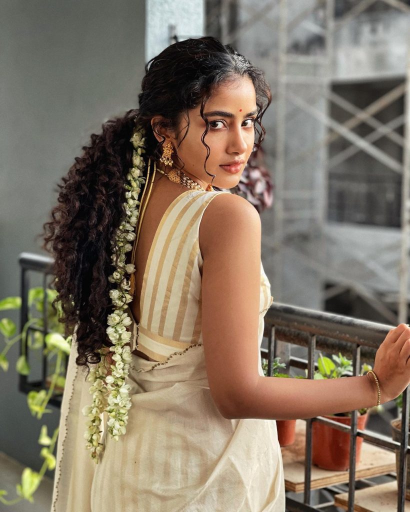 Anupama Parameshwaran in white saree and sleeveless bouse