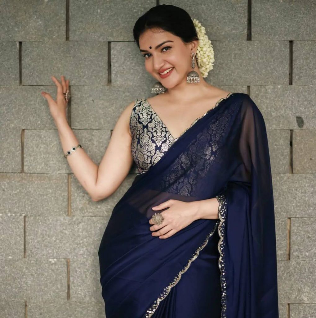 Actress Honey Rose in dark blue saree and sleeveless blouse
