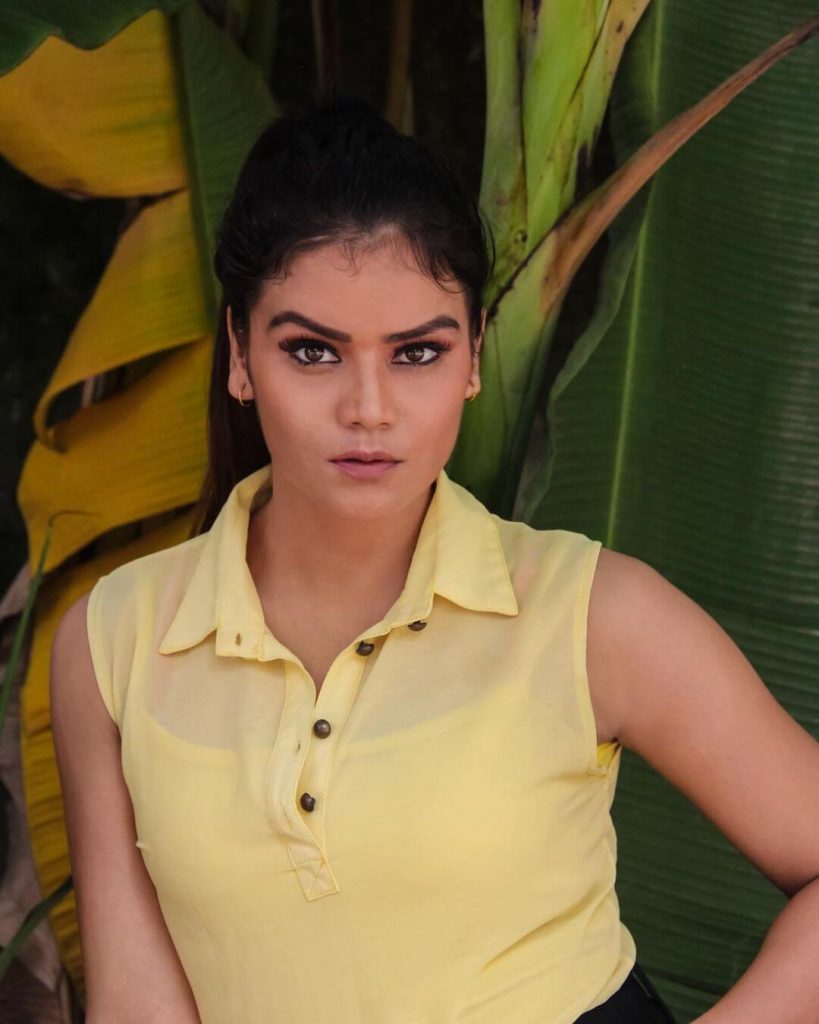 Actress Leena Singh close up in yellow sleeveless