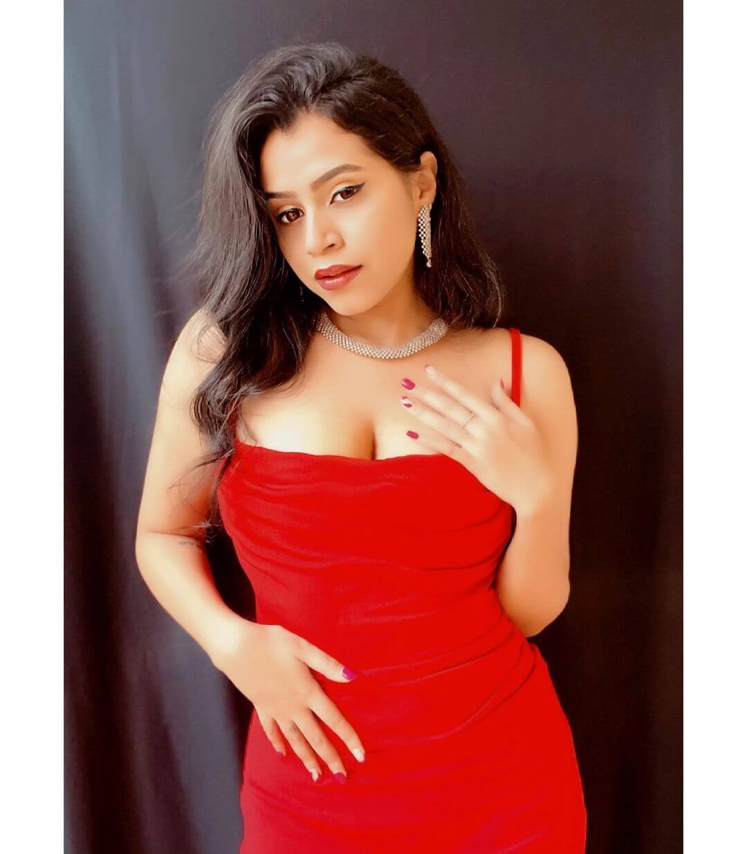 Actress Nisha Hegde in sexy red sleeveless gown