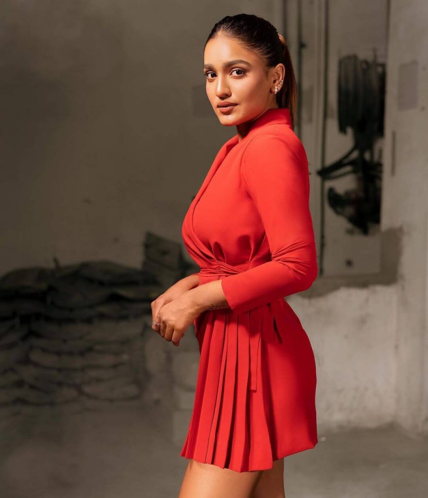 Actress Saniya Iyappan in orange short gown