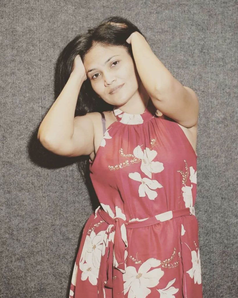 Actress Sunita Rajput close up in sleeveless gown