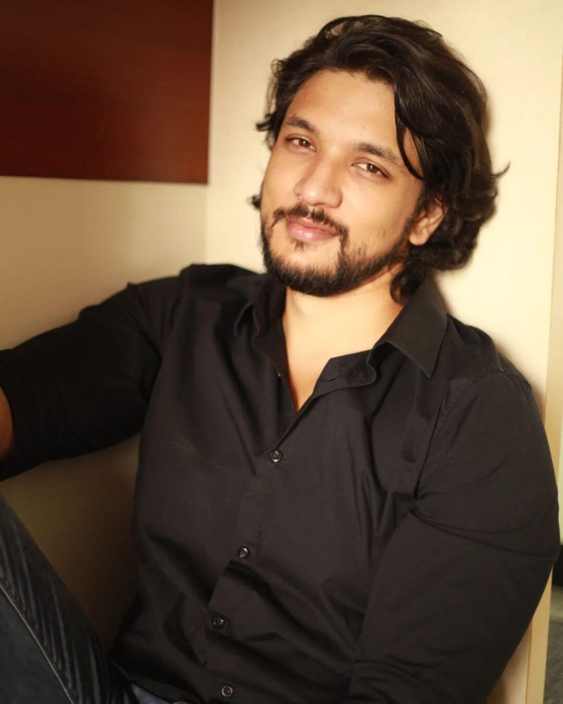 Actor Gautham Karthik close up in black shirt