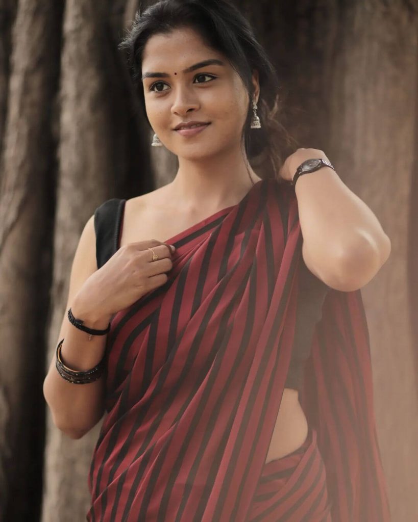 Actress Lakshmi Priya in saree and sleeveless blouse