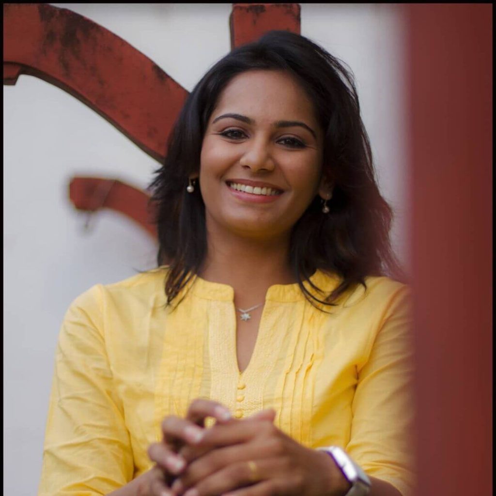 Lakshmi Priyaa Chandramouli close up in yellow kurta