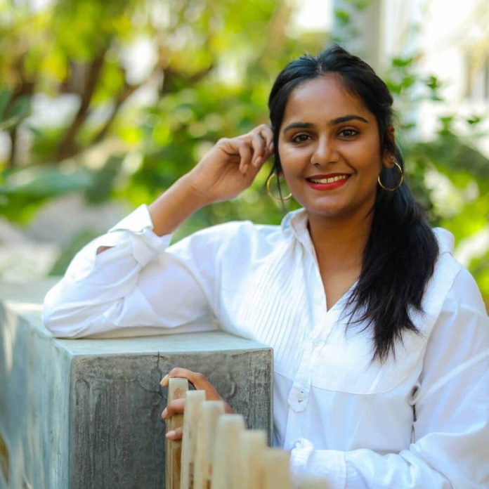Lakshmi Priyaa Chandramouli close up in white shirt