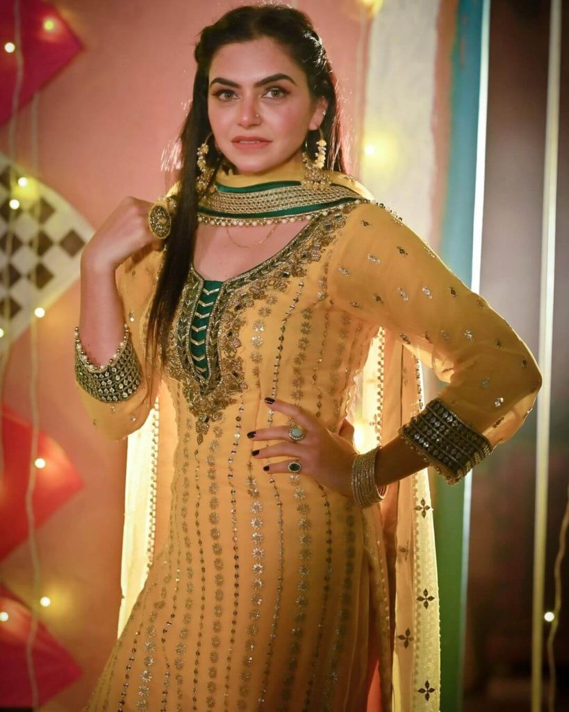 Actress Nisha Bano in golden yellow salwar