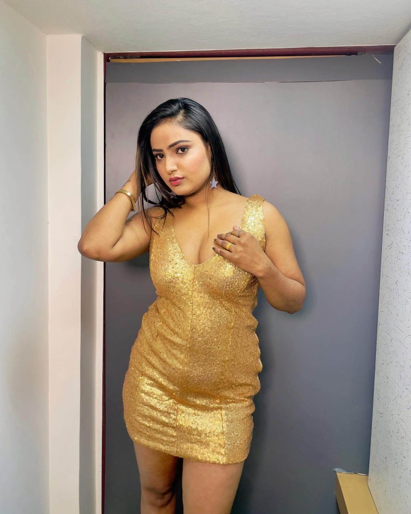 Actress Shyna Khatri in sexy golden color gown