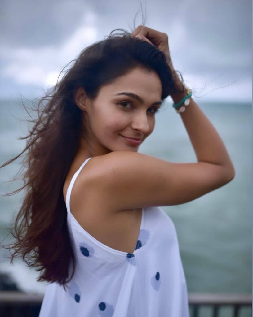 Actress Andrea Jeremiah in stylish while and blue doted sleeveless outfit