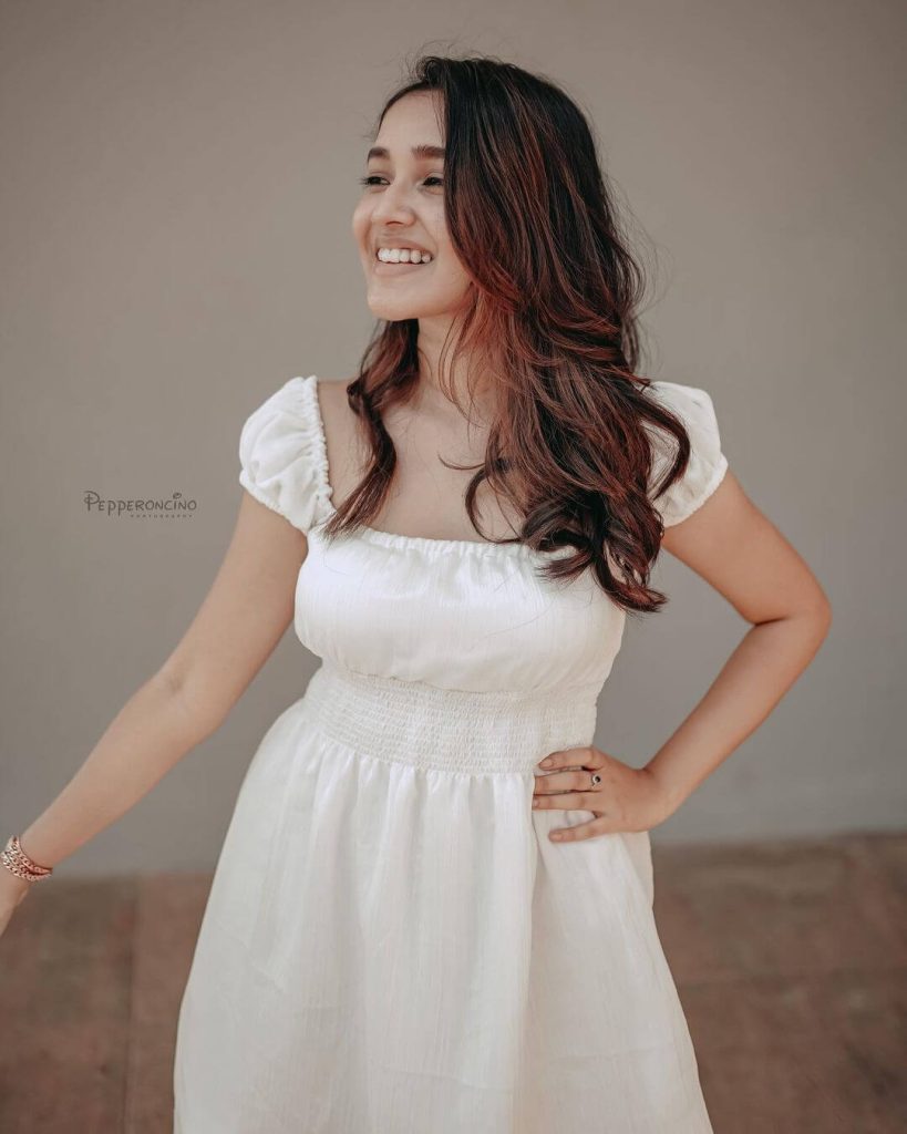 Actress Anikha Surendran in smocked waist square neck bubble sleeve white attire