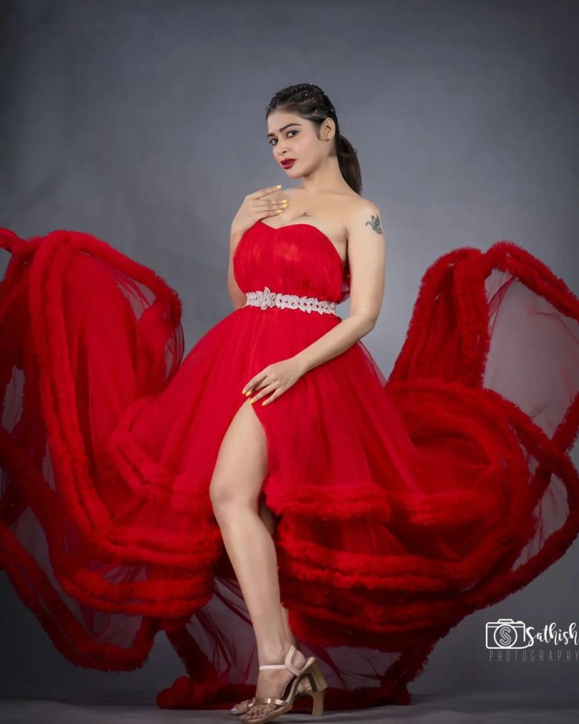 Dharsha Gupta in a splendid red gown
