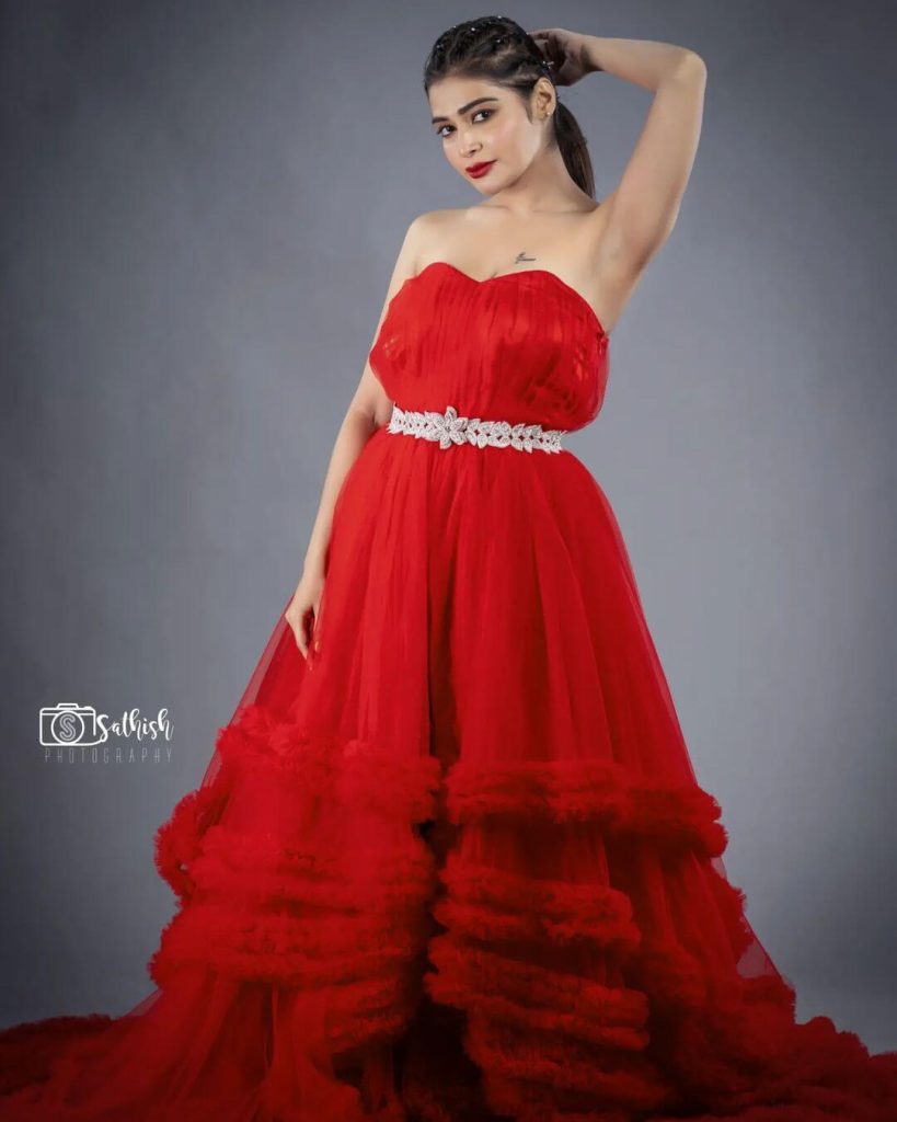 Dharsha Gupta in a splendid red gown