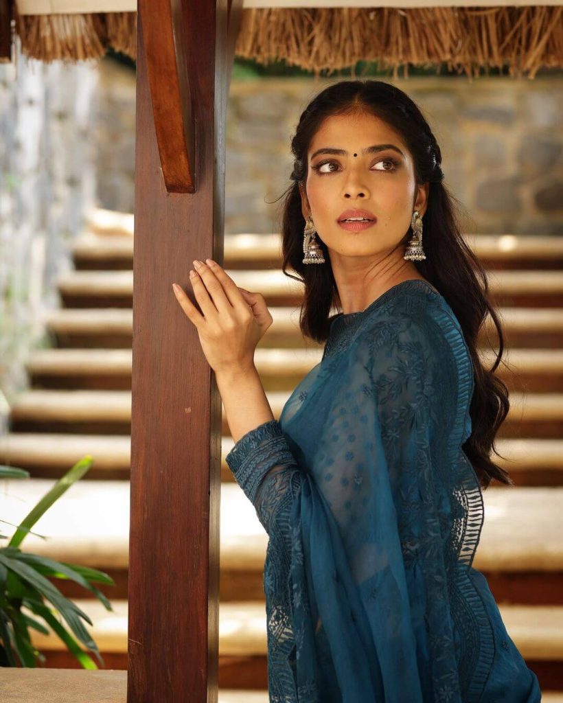 Actress Malavika Mohanan gorgeous saree and a full-sleeve top in the same hue