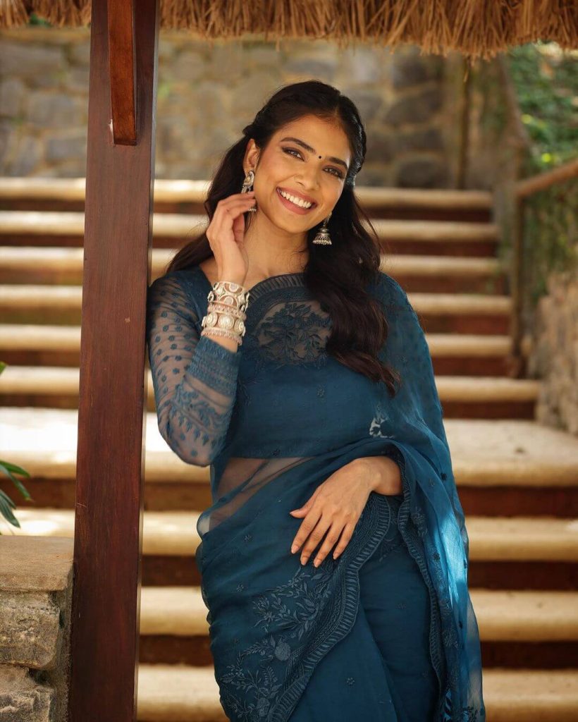 Actress Malavika Mohanan gorgeous saree and a full-sleeve top in the same hue