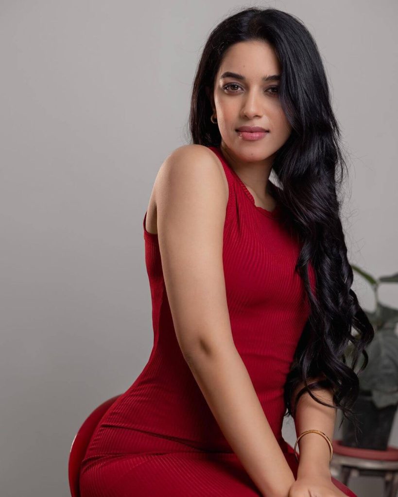 Actress Mrinalini in red sleeveless gown