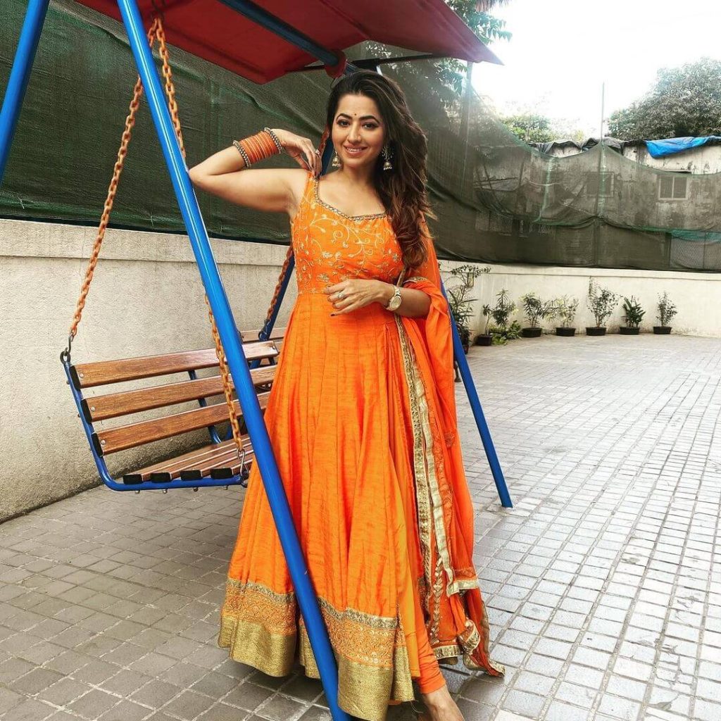 Actress Ridheema Tiwari in an orange attire
