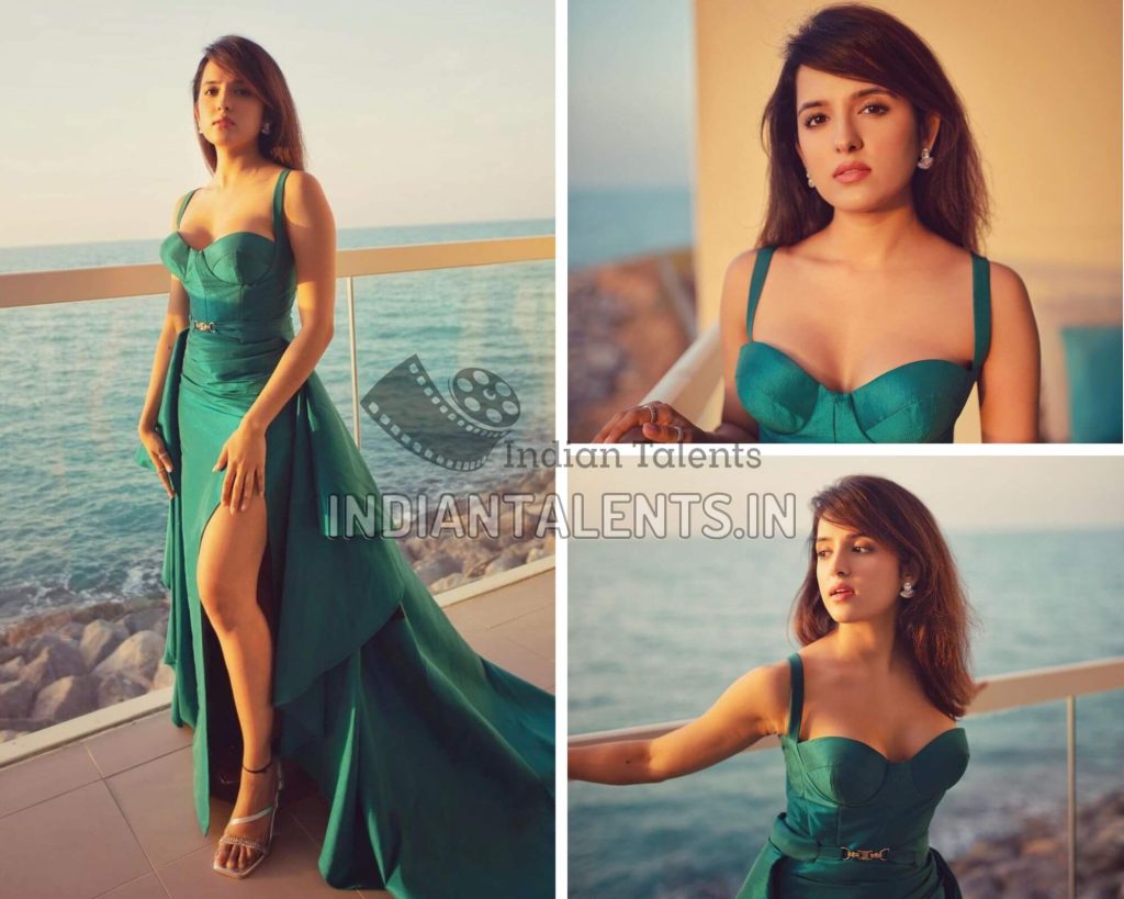 Actress Shirley Setia in thigh-high slit blue tulle gown with a belted floor-sweeping draped overskirt